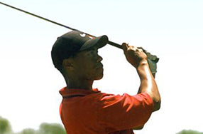 tiger woods from the side in backswing